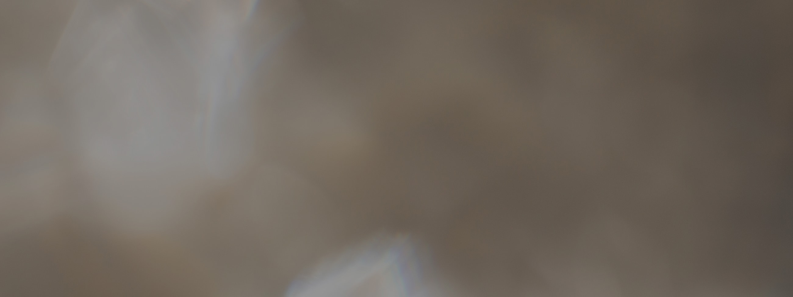 Abstract blurred background with soft light effects.