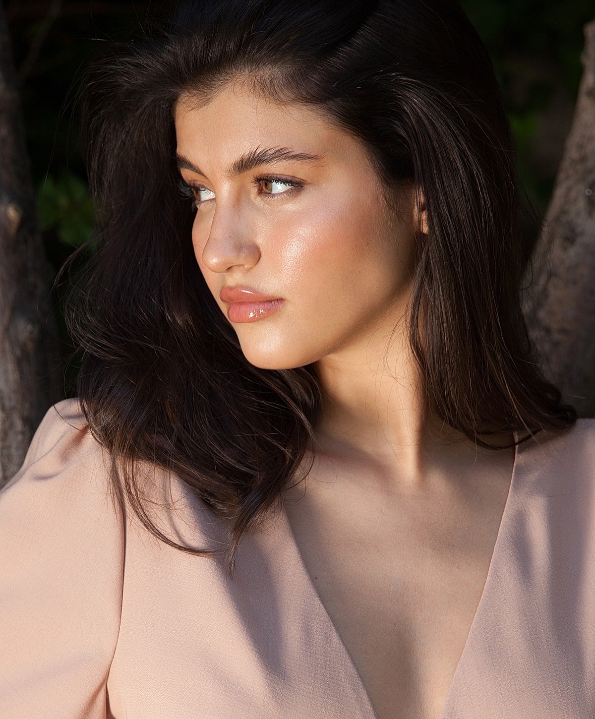 Profile of a young woman with dark hair.