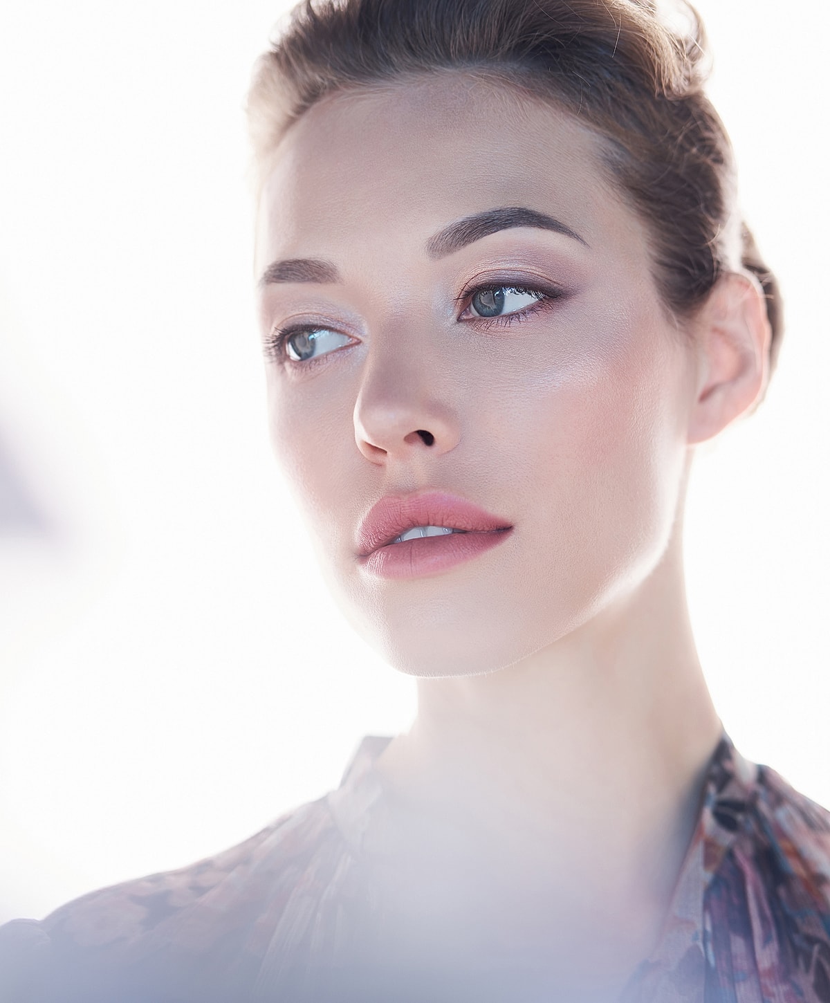 Close-up portrait of a woman with natural makeup.